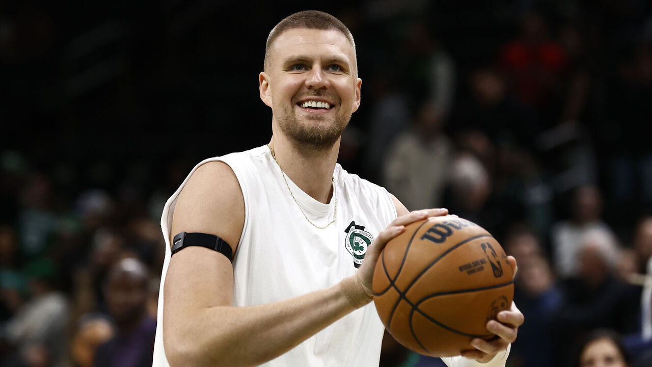 BOSTON, MA - NOVEMBER 16: Kristaps Porzingis #8 of the Boston Celtics smiles as he warms up before the game between the Boston Celtics and the Toronto Raptors at TD Garden on November 16, 2024 in Boston, Massachusetts. NOTE TO USER: User expressly acknowledges and agrees that, by downloading and/or using this Photograph, user is consenting to the terms and conditions of the Getty Images License Agreement.