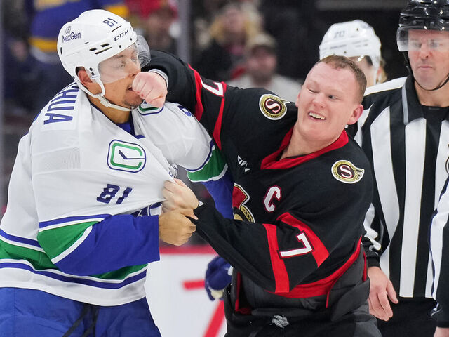 OTTAWA, CANADA - NOVEMBER 23: Brady Tkachuk #7 of the Ottawa Senators fights Dakota Joshua #81 of the Vancouver Canucks during the third period at Canadian Tire Centre on November 23, 2024 in Ottawa, Ontario, Canada.