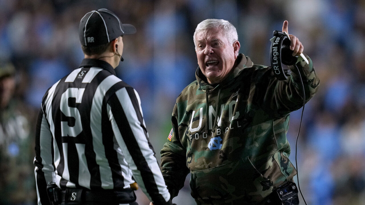 CHAPEL HILL, NORTH CAROLINA - NOVEMBER 16: Head coach Mack Brown of the North Carolina Tar Heels argues with an official during the first half of the game against the Wake Forest Demon Deacons at Kenan Memorial Stadium on November 16, 2024 in Chapel Hill, North Carolina.