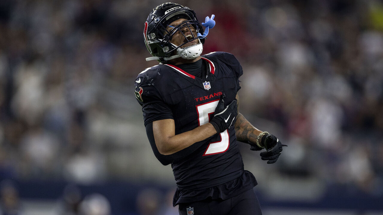 ARLINGTON, TEXAS - NOVEMBER 18: Jalen Pitre #5 of the Houston Texans reacts during an NFL Football game against the Dallas Cowboys at AT&T Stadium on November 18, 2024 in Arlington, Texas.