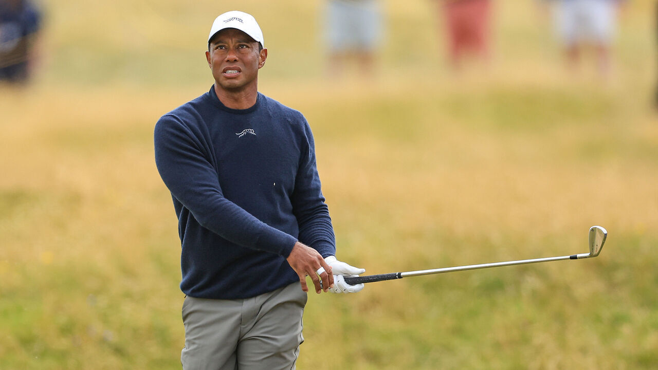 TROON, SCOTLAND - JULY 19: Tiger Woods of The United States plays his second shot on the 13th hole on day two of The 152nd Open championship at Royal Troon on July 19, 2024 in Troon, Scotland.