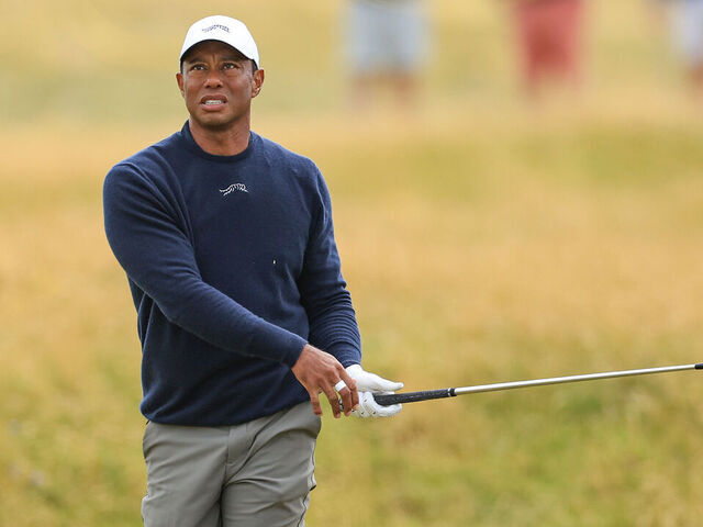 TROON, SCOTLAND - JULY 19: Tiger Woods of The United States plays his second shot on the 13th hole on day two of The 152nd Open championship at Royal Troon on July 19, 2024 in Troon, Scotland.