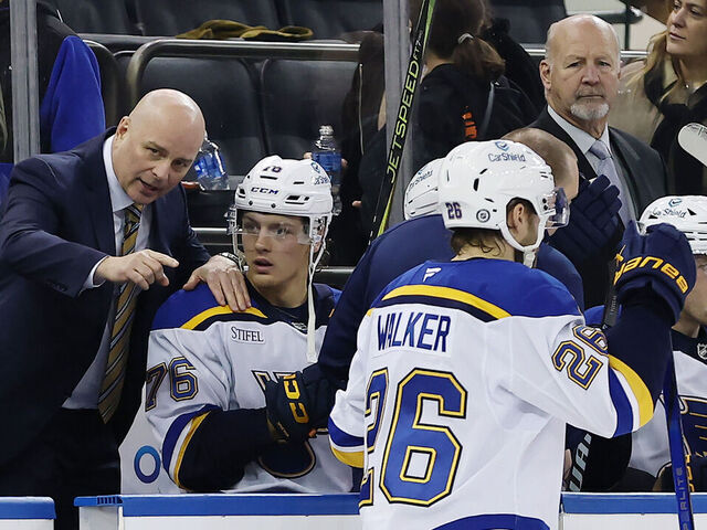 NEW YORK, NEW YORK - NOVEMBER 25: Head coach Jim Montgomery of the St. Louis Blues (L) makes his Blues coaching debut, directing his team during the second period against the New York Rangers at Madison Square Garden on November 25, 2024 in New York City.