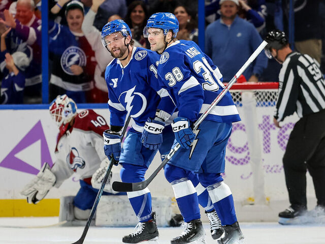 TAMPA, FL - NOVEMBER 25: Luke Glendening #11 of the Tampa Bay Lightning celebrates his goal against Alexandar Georgiev #40 of the Colorado Avalanche with Brandon Hagel #38 during the first period at the Amalie Arena on November 25, 2024 in Tampa, Florida.