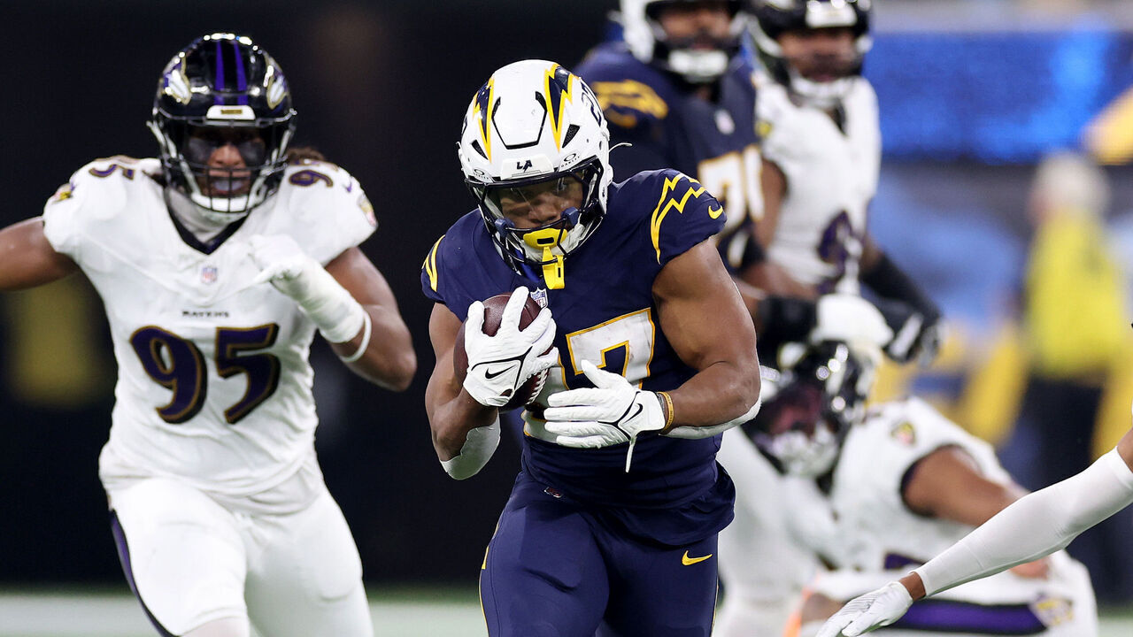 INGLEWOOD, CALIFORNIA - NOVEMBER 25: J.K. Dobbins #27 of the Los Angeles Chargers runs with the ball against the Baltimore Ravens during the first quarter in the game at SoFi Stadium on November 25, 2024 in Inglewood, California.