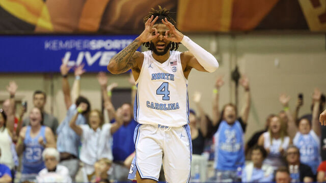 LAHAINA, HAWAII - NOVEMBER 25: RJ Davis #4 of the North Carolina Tar Heels celebrates after hitting a three point shot during the second half of the Maui Invitational against the Dayton Flyers at the Lahaina Civic Center on November 25, 2024 in Lahaina, Hawaii.