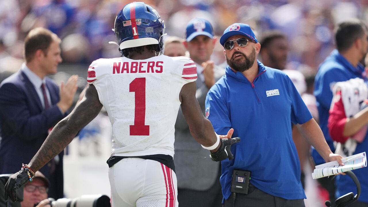 CLEVELAND, OHIO - SEPTEMBER 22: Brian Daboll, head coach of the New York Giants, congratulates Malik Nabers #1 after his touchdown against the Cleveland Browns during the second quarter at Cleveland Browns Stadium on September 22, 2024 in Cleveland, Ohio.