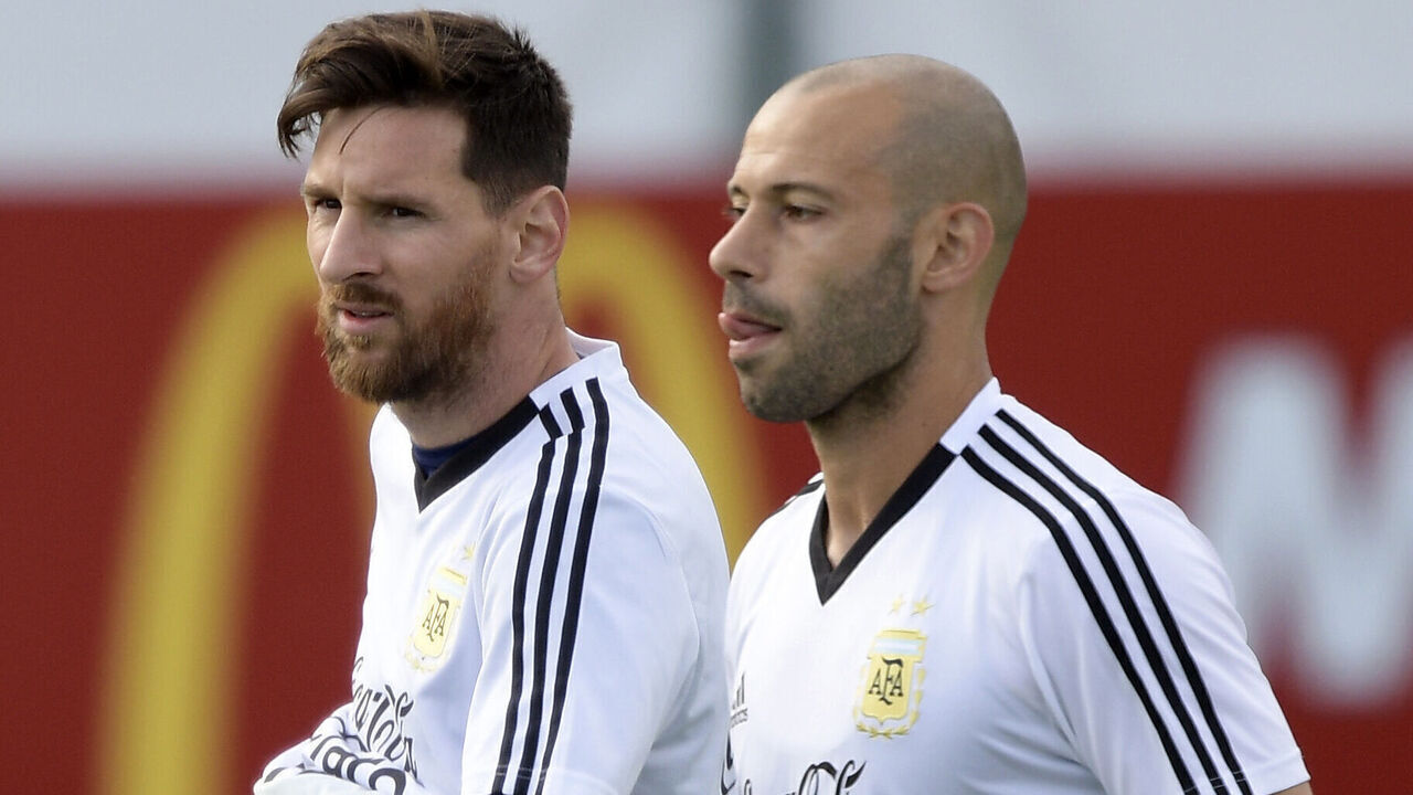Argentina's forward Lionel Messi (L) gestures next to midfielder Javier Mascherano during a training session of Argentina's national football team at the team's base camp in Bronnitsy, near Moscow, on June 11, 2018 ahead of the Russia 2018 World Cup football tournament.
