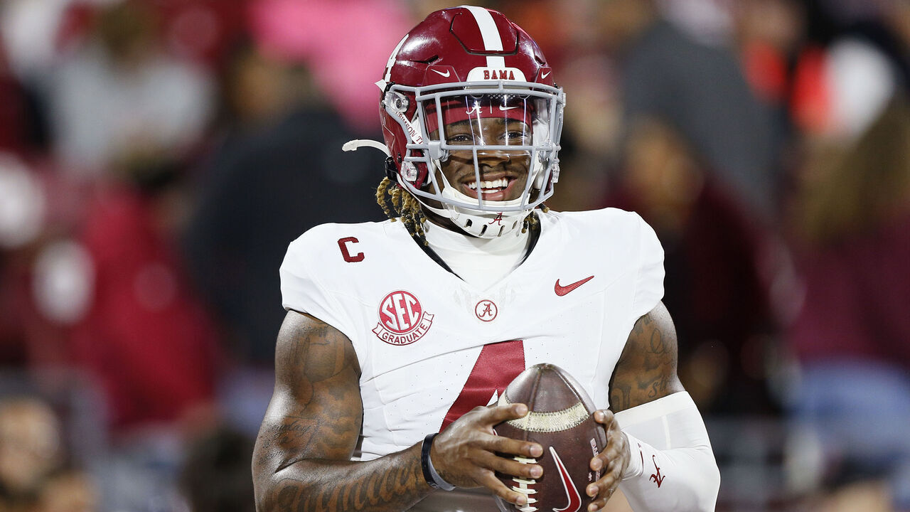 NORMAN, OKLAHOMA - NOVEMBER 23: Quarterback Jalen Milroe #4 of the Alabama Crimson Tide smiles before a game against the Oklahoma Sooners at Gaylord Family Oklahoma Memorial Stadium on November 23, 2024 in Norman, Oklahoma.