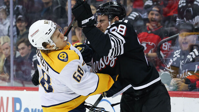 NEWARK, NJ - NOVEMBER 25: New Jersey Devils right wing Timo Meier (28) hits Nashville Predators left wing Zachary L'Heureux (68) during a NHL game between the Nashville Predators and New Jersey Devils at Prudential Center on November 25, 2024 in Newark, New Jersey.