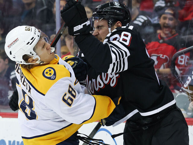 NEWARK, NJ - NOVEMBER 25: New Jersey Devils right wing Timo Meier (28) hits Nashville Predators left wing Zachary L'Heureux (68) during a NHL game between the Nashville Predators and New Jersey Devils at Prudential Center on November 25, 2024 in Newark, New Jersey.