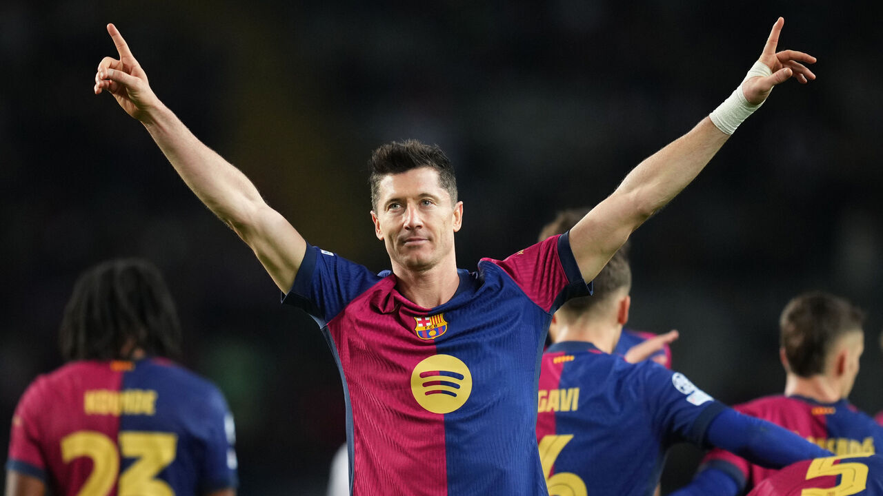 BARCELONA, SPAIN - NOVEMBER 26: Robert Lewandowski of FC Barcelona celebrates scoring his team's third goal during the UEFA Champions League 2024/25 League Phase MD5 match between FC Barcelona and Stade Brestois 29 at Estadi Olimpic Lluis Companys on November 26, 2024 in Barcelona, Spain.