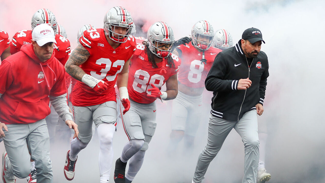 COLUMBUS, OH - NOVEMBER 23: Ohio State Buckeyes defensive end Jack Sawyer (33), tight end Gee Scott Jr. (88) and head coach Ryan Day run onto the field before the game against the Indiana Hoosiers and the Ohio State Buckeyes on November 23, 2024, at Ohio Stadium in Columbus, OH.