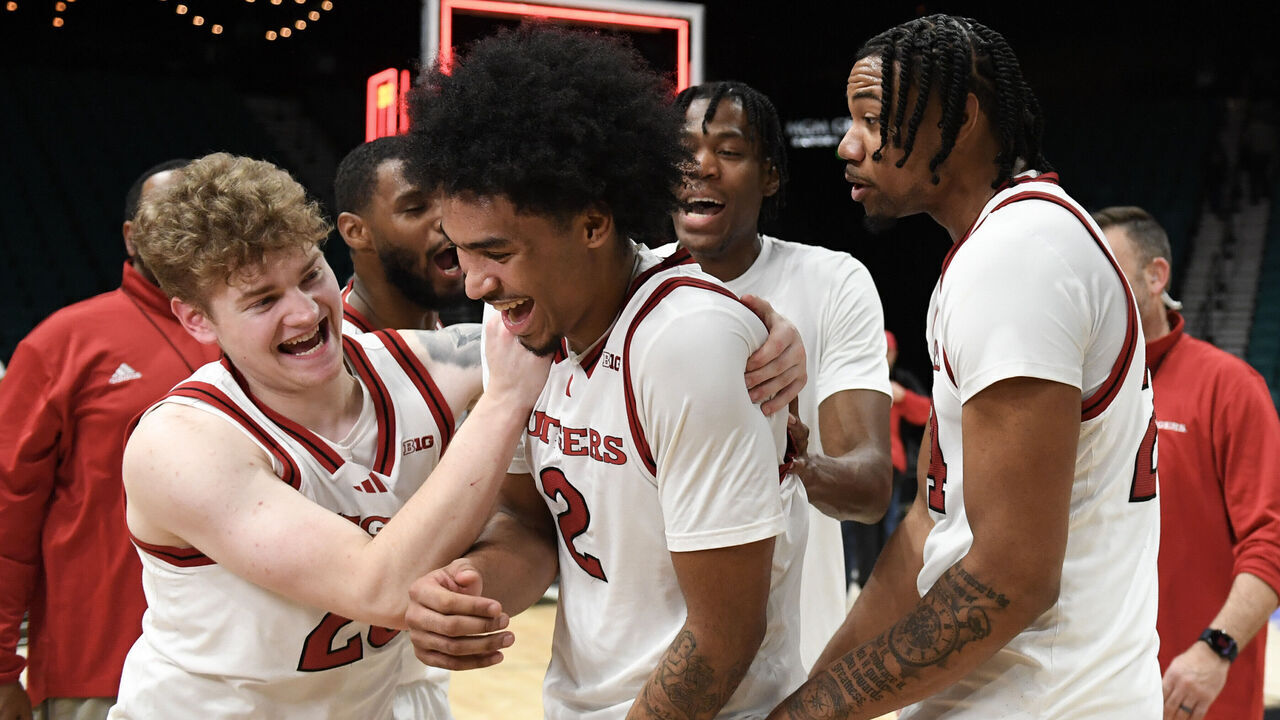 LAS VEGAS, NEVADA - NOVEMBER 26: PJ Hayes IV #23, Dylan Harper #2 and Lathan Sommerville #24 of the Rutgers Scarlet Knights celebrate defeating the Notre Dame Fighting Irish 85-84 in overtime during the Players Era Festival basketball tournament at at MGM Grand Garden Arena on November 26, 2024 in Las Vegas, Nevada.