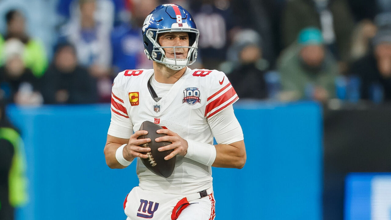 Munich, Germany - November 10: Daniel Jones of New York Giants controls the ball during the NFL Munich Game 2024 between New York Giants and Carolina Panthers at Allianz Arena on November 10, 2024 in Munich, Germany.