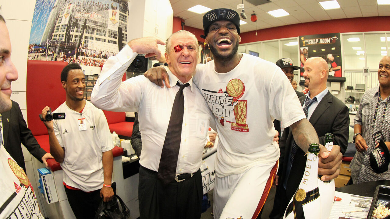 MIAMI, FL - JUNE 20: President of the Miami Heat Pat Riley celebrates with LeBron James #6 of the Miami Heat and his good luck Nike sneaker eyelet after defeating the San Antonio Spurs in Game Seven of the 2013 NBA Finals on June 20, 2013 at American Airlines Arena in Miami, Florida. Mandatory Copyright Notice: Copyright 2013 NBAE