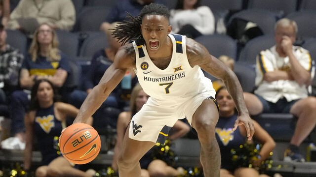 MORGANTOWN, WV- OCTOBER 18: Javon Small #7 of the West Virginia Mountaineers dribbles up court during an exhibition college basketball game against the Charleston Golden Eagles at WVU Coliseum on October 18, 2024 in Morgantown, West Virginia.