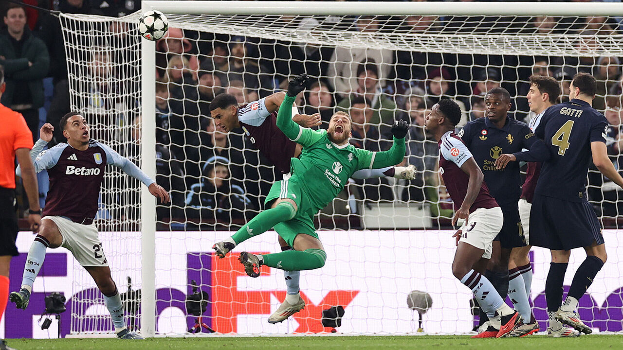 BIRMINGHAM, ENGLAND - NOVEMBER 27: Diego Carlos of Aston Villa fouls Michele Di Gregorio of Juventus, before Morgan Rogers of Aston Villa goes on to score a goal which is later ruled out following a VAR Review, during the UEFA Champions League 2024/25 League Phase MD5 match between Aston Villa FC and Juventus at Villa Park on November 27, 2024 in Birmingham, England.