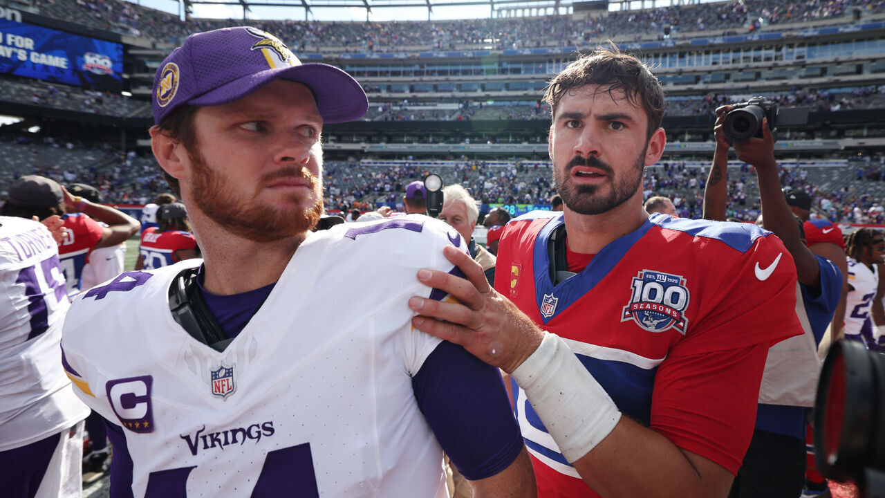 EAST RUTHERFORD, NEW JERSEY - SEPTEMBER 08: Daniel Jones #8 of the New York Giants greets Sam Darnold #14 of the Minnesota Vikings after the game at MetLife Stadium on September 08, 2024 in East Rutherford, New Jersey. The Vikings defeated the Giants 28-6.
