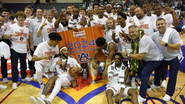 LAHAINA, HI - NOVEMBER 27: The Auburn Tigers celebrate winning the Championship of the Maui Invitational college basketball tournament against the Memphis Tigers at The Lahaina Civic Center on November 27, 2024 in Lahaina, Hawaii.