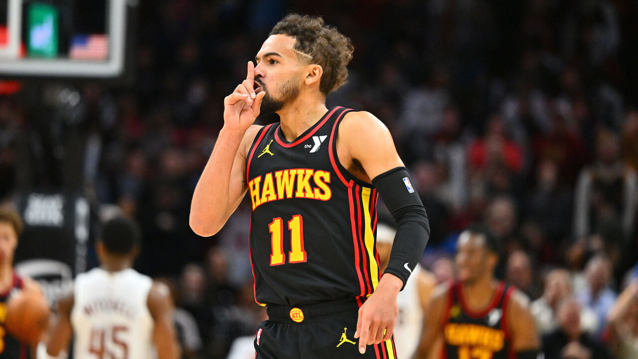 CLEVELAND, OHIO - NOVEMBER 27: Trae Young #11 of the Atlanta Hawks silences the crowd during the fourth quarter against the Cleveland Cavaliers at Rocket Mortgage Fieldhouse on November 27, 2024 in Cleveland, Ohio. The Hawks defeated the Cavaliers 135-124.