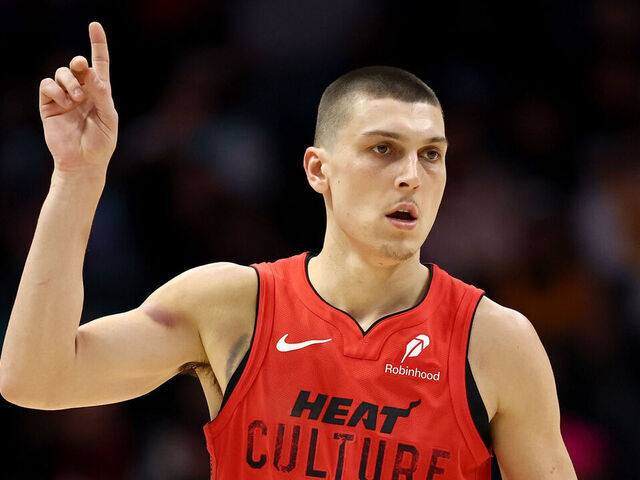 CHARLOTTE, NORTH CAROLINA - NOVEMBER 27: Tyler Herro #14 of the Miami Heat reacts following a basket during the second half of the game against the Charlotte Hornets at Spectrum Center on November 27, 2024 in Charlotte, North Carolina.