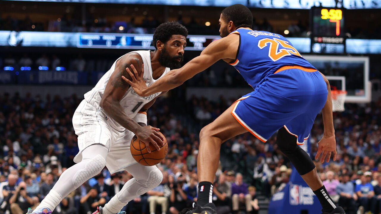 DALLAS, TEXAS - NOVEMBER 27: Kyrie Irving #11 of the Dallas Mavericks is defended by Mikal Bridges #25 of the New York Knicks during the second half at American Airlines Center on November 27, 2024 in Dallas, Texas. NOTE TO USER: User expressly acknowledges and agrees that, by downloading and/or using this photograph, user is consenting to the terms and conditions of the Getty Images License Agreement.