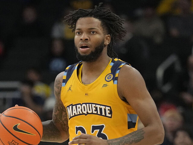 MILWAUKEE, WISCONSIN - NOVEMBER 27: David Joplin #23 of the Marquette Golden Eagles dribbles the ball against the Stonehill Skyhawks during the first half at Fiserv Forum on November 27, 2024 in Milwaukee, Wisconsin.