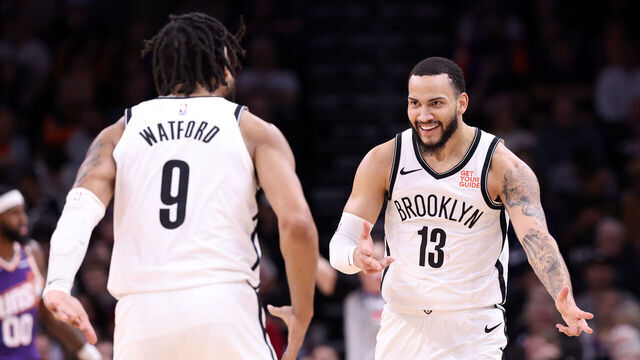 PHOENIX, ARIZONA - NOVEMBER 27: Tyrese Martin #13 of the Brooklyn Nets reacts with Trendon Watford #9 after hitting a three point shot during the second half against the Phoenix Suns at Footprint Center on November 27, 2024 in Phoenix, Arizona.