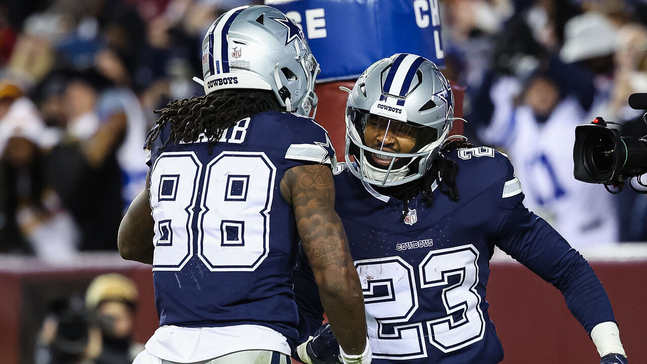 LANDOVER, MD - JANUARY 07: CeeDee Lamb #88 and Rico Dowdle #23 of the Dallas Cowboys celebrate after an offensive touchdown against the Washington Commanders during the second half of the game at FedExField on January 7, 2024 in Landover, Maryland.