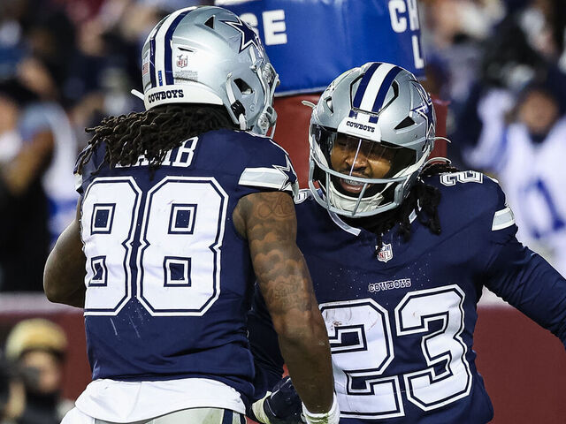 LANDOVER, MD - JANUARY 07: CeeDee Lamb #88 and Rico Dowdle #23 of the Dallas Cowboys celebrate after an offensive touchdown against the Washington Commanders during the second half of the game at FedExField on January 7, 2024 in Landover, Maryland.