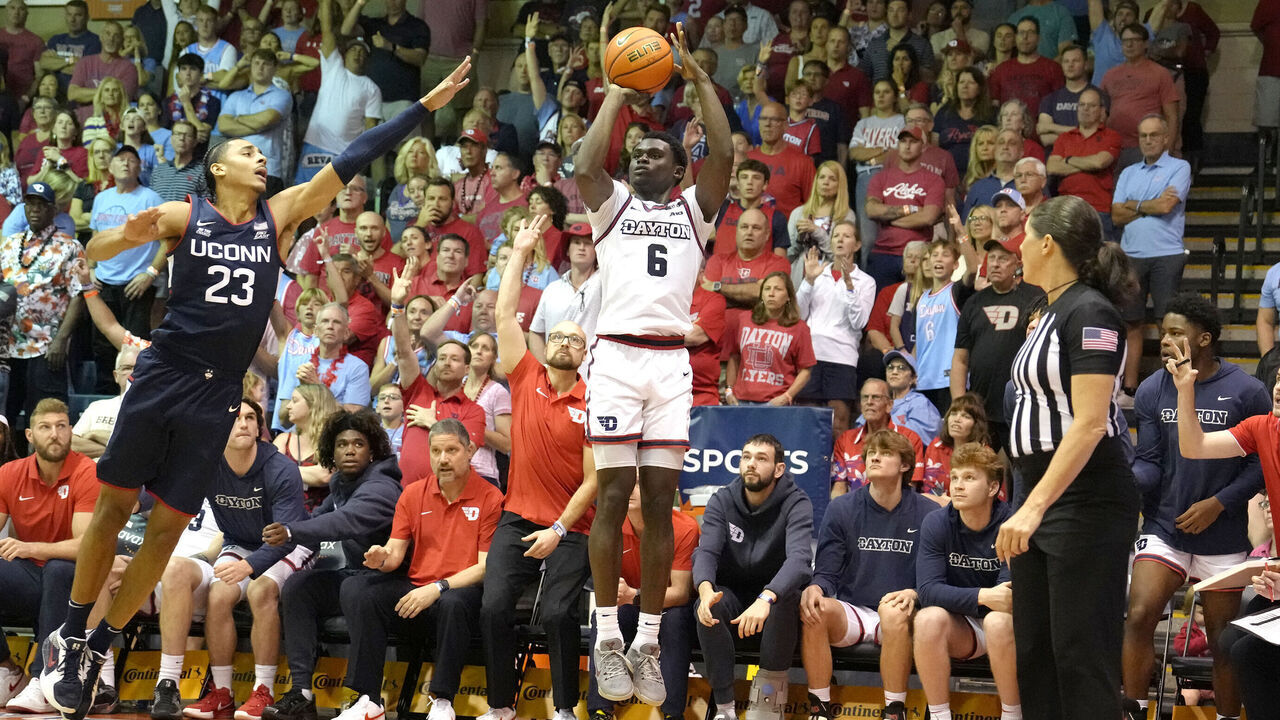 LAHAINA, HI - NOVEMBER 27: Enoch Cheeks #6 of the Dayton Flyers takes a shot over Jayden Ross #23 of the Connecticut Huskies in the second half during a Maui Invitational college basketball game at The Lahaina Civic Center on November 27, 2024 in Lahaina, Hawaii.