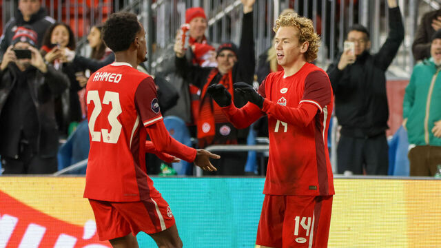 J. Shaffelburg #14 celebrates his goal with Ahmed #23 during the CONCACAF Nations League Quarter Final match between Team Canada and Suriname at BMO Field in Toronto, Ontario, Canada, on November 19, 2024.
