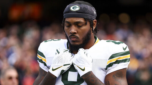 CHICAGO, ILLINOIS - NOVEMBER 17: Josh Jacobs #8 of the Green Bay Packers stands on the sidelines during the national anthem prior to an NFL football game against the Chicago Bears at Soldier Field on November 17, 2024 in Chicago, Illinois.
