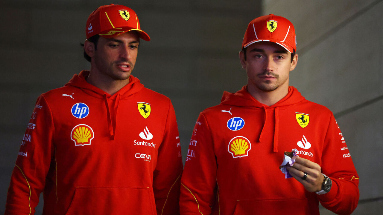 LUSAIL CITY, QATAR - NOVEMBER 28: Carlos Sainz of Spain and Ferrari nd Charles Leclerc of Monaco and Ferrari walk in the Paddock during previews ahead of the F1 Grand Prix of Qatar at Lusail International Circuit on November 28, 2024 in Lusail City, Qatar.