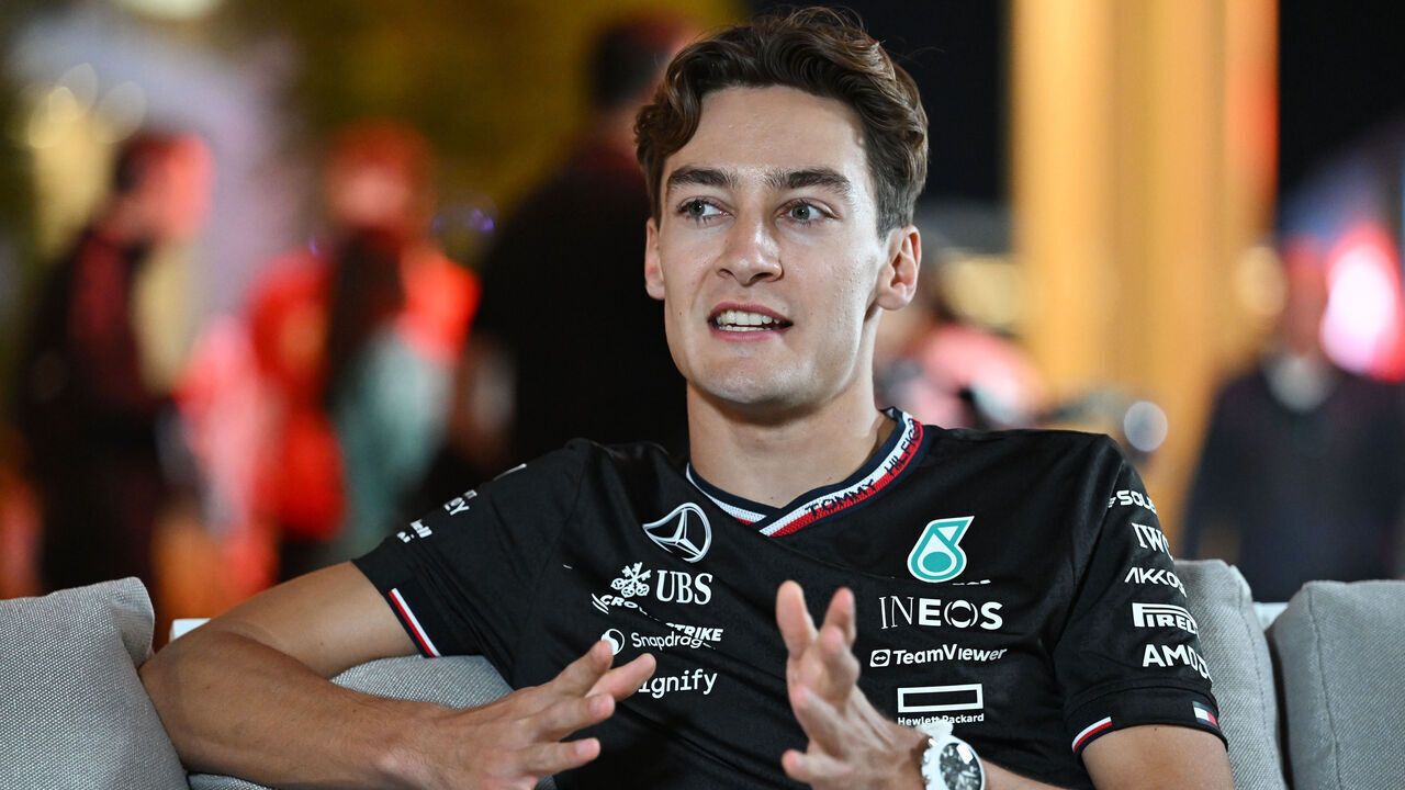 LUSAIL CITY, QATAR - NOVEMBER 28: George Russell of Great Britain and Mercedes talks to the media in the Paddock during previews ahead of the F1 Grand Prix of Qatar at Lusail International Circuit on November 28, 2024 in Lusail City, Qatar.