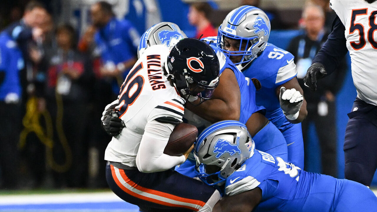 DETROIT, MI - NOVEMBER 28: Chicago Bears quarterback Caleb Williams (18) is tackled during the Detroit Lions versus the Chicago Bears game on Thursday November 28, 2024 at Ford Field in Detroit, MI.