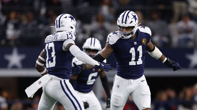 ARLINGTON, TEXAS - NOVEMBER 28: DeMarvion Overshown #13 and Micah Parsons #11 of the Dallas Cowboys celebrate after a defense play during the second quarter against the New York Giants at AT&T Stadium on November 28, 2024 in Arlington, Texas.