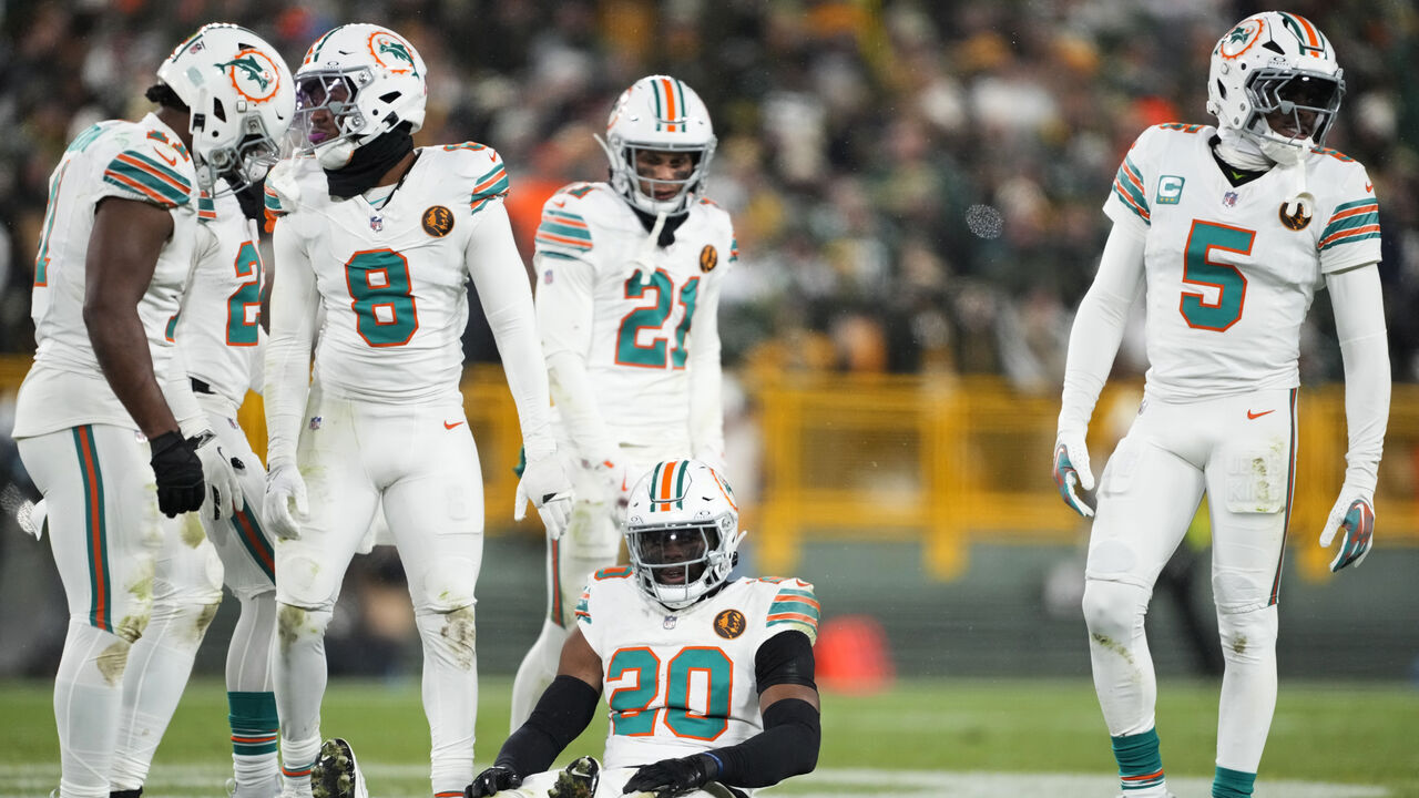 GREEN BAY, WISCONSIN - NOVEMBER 28: Jordyn Brooks #20 of the Miami Dolphins sits on the field during the second half of the game against the Green Bay Packers at Lambeau Field on November 28, 2024 in Green Bay, Wisconsin.