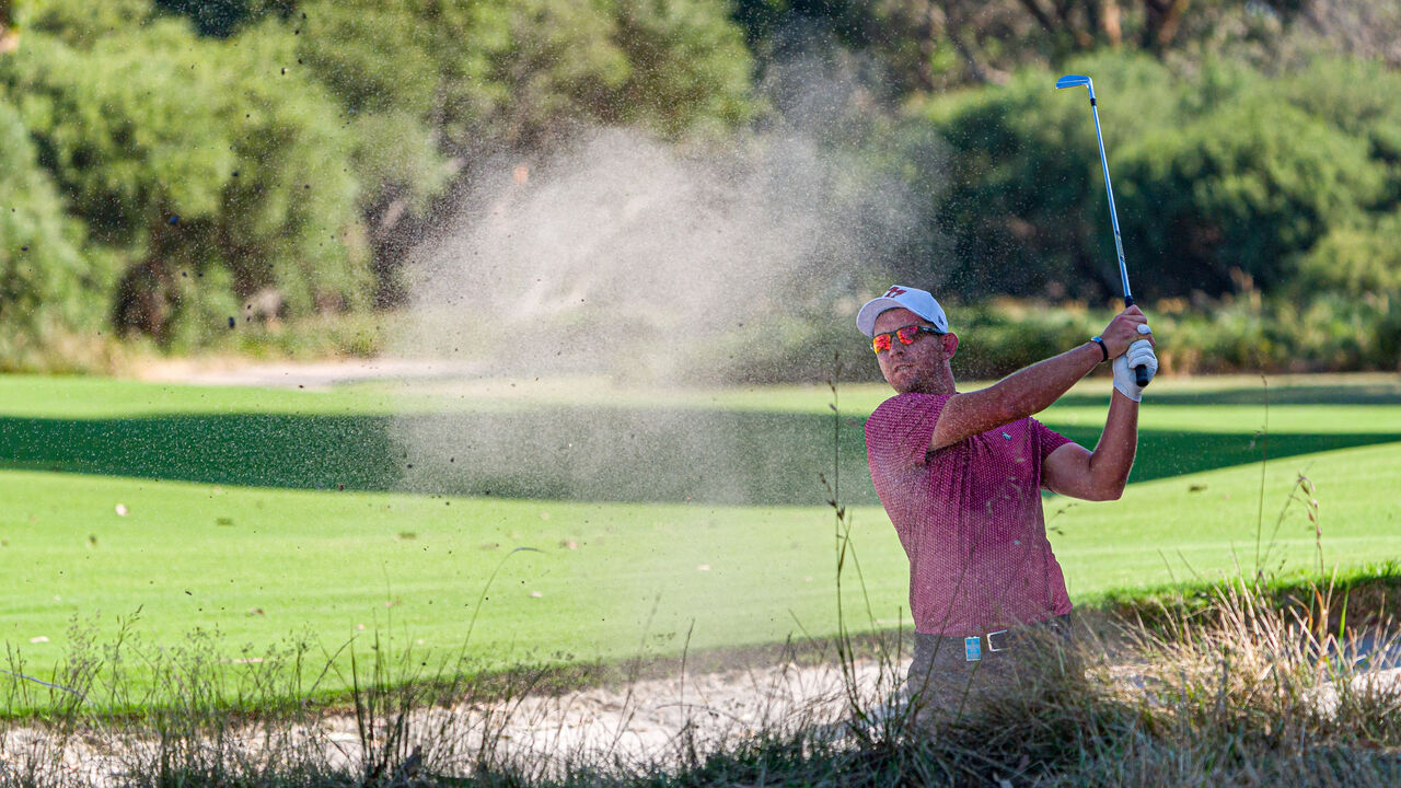 MELBOURNE, AUSTRALIA - NOVEMBER 29: Lucas Herbert of Australia plays his bunker shot on the eighteenth hole on day two of the ISPS Handa Australian Open 2024 at Kingston Heath Golf Club on November 29, 2024 in Melbourne, Australia.