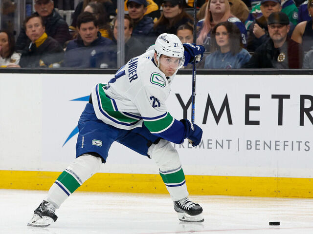 BOSTON, MASSACHUSETTS - NOVEMBER 26: Nils Hoglander #21 of the Vancouver Canucks skates against the Boston Bruins during the second period at the TD Garden on November 26, 2024 in Boston, Massachusetts. The Canucks won 2-0.
