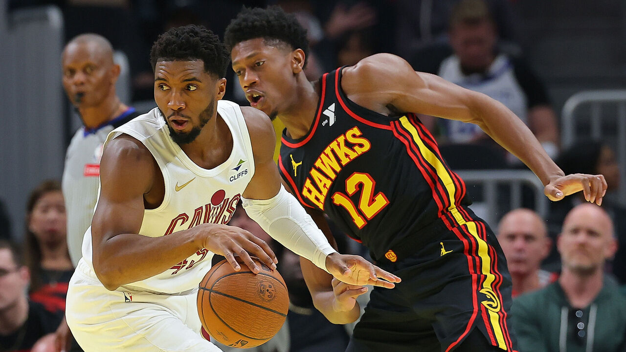 ATLANTA, GEORGIA - NOVEMBER 29: Donovan Mitchell #45 of the Cleveland Cavaliers spins against De'Andre Hunter #12 of the Atlanta Hawks during the first quarter of the Emirates NBA Cup game at State Farm Arena on November 29, 2024 in Atlanta, Georgia. NOTE TO USER: User expressly acknowledges and agrees that, by downloading and/or using this photograph, user is consenting to the terms and conditions of the Getty Images License Agreement.