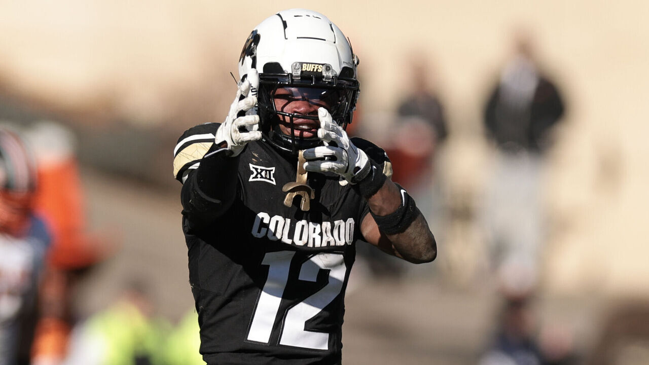 BOULDER, COLORADO - NOVEMBER 29: Travis Hunter #12 of the Colorado Buffaloes reacts after catching a pass during the fourth quarter against the Oklahoma State Cowboys at Folsom Field on November 29, 2024 in Boulder, Colorado.