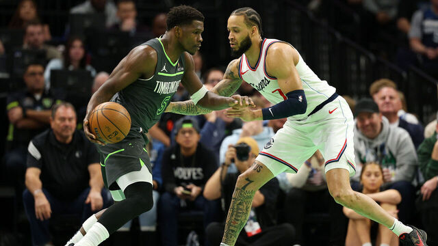 MINNEAPOLIS, MINNESOTA - NOVEMBER 29: Anthony Edwards #5 of the Minnesota Timberwolves dribbles the ball against Amir Coffey #7 of the LA Clippers in the first quarter during the Emirates NBA Cup at Target Center on November 29, 2024 in Minneapolis, Minnesota.