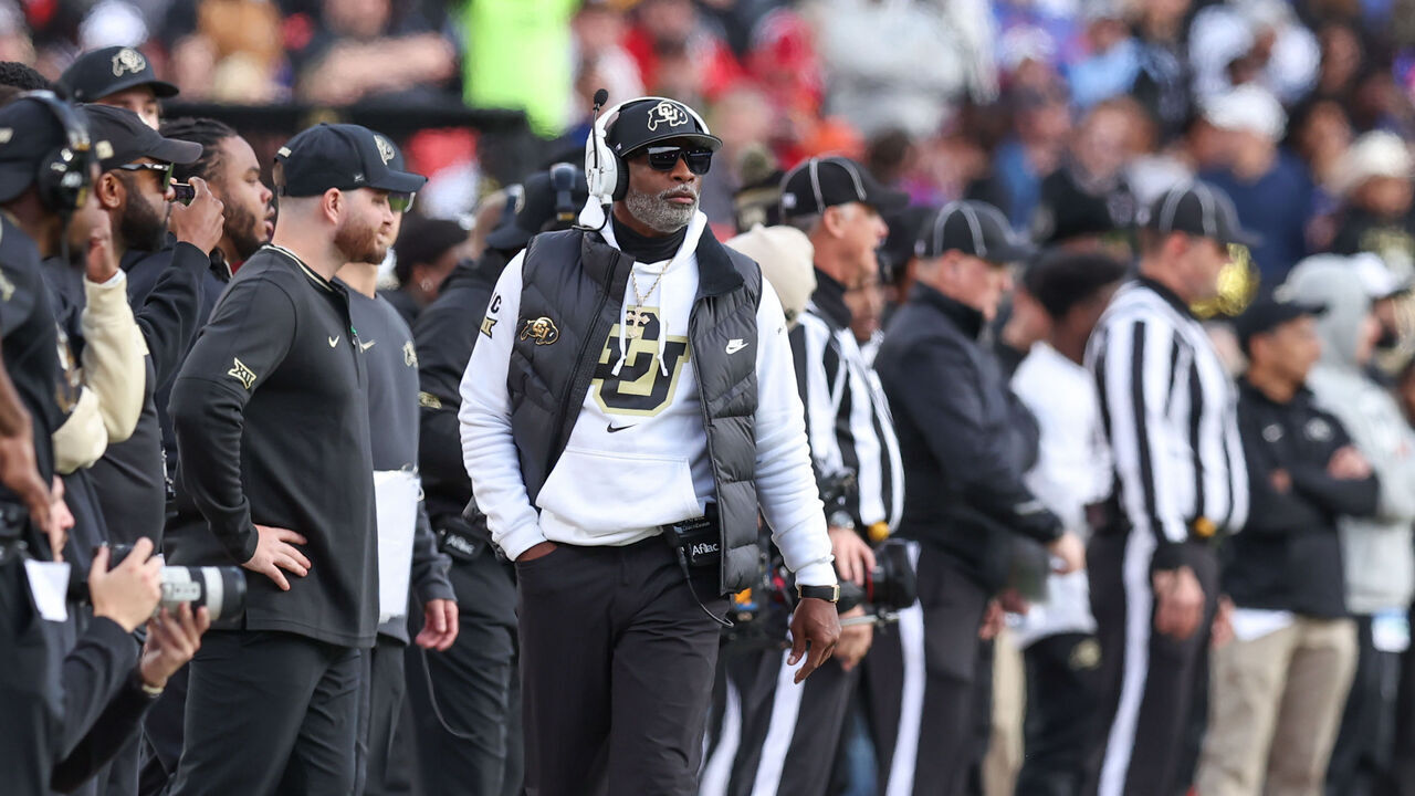 KANSAS CITY, MO - NOVEMBER 23: Colorado Buffaloes head coach Deion Sanders walks the sidelines in the first quarter of a Big 12 game between the Colorado Buffaloes and Kansas Jayhawks on November 23, 2024 at GEHA Field at Arrowhead Stadium in Kansas City, MO.