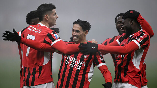 MILAN, ITALY - NOVEMBER 30: Tiijani Reijnders of Milan celebrates his goal with Alvaro Morata and Youssouf Fofana of Milan during the Serie A match between Milan and Empoli at Stadio Giuseppe Meazza on November 30, 2024 in Milan, Italy.