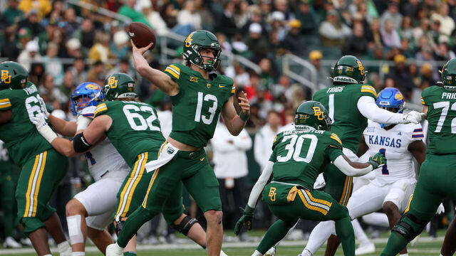 WACO, TX - NOVEMBER 30: Baylor Bears quarterback Sawyer Robertson (13) throws the ball into the flat during the Big 12 college football game between Baylor Bears and Kansas Jayhawks on November 30, 2024, at McLane Stadium in Waco, TX.