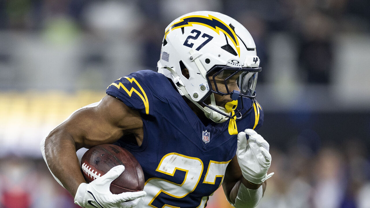 INGLEWOOD, CALIFORINA - NOVEMBER 25: J.K. Dobbins #27 of the Los Angeles Chargers runs with the ball during an NFL Football game against the Baltimore Ravens at SoFi Stadium on November 25, 2024 in Inglewood, Califorina.