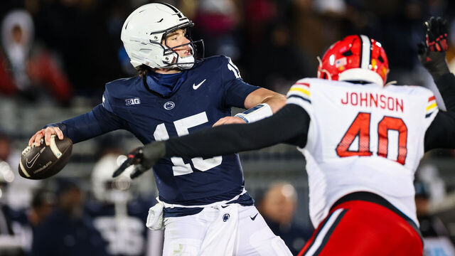 STATE COLLEGE, PA - NOVEMBER 30: Drew Allar #15 of the Penn State Nittany Lions attempts a pass as Taizse Johnson #40 of the Maryland Terrapins applies pressure during the first half at Beaver Stadium on November 30, 2024 in State College, Pennsylvania.