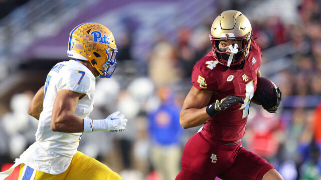 CHESTNUT HILL, MA - NOVEMBER 30: Boston College Eagles wide receiver Reed Harris (4) runs with the ball after a catch pursued by Pittsburgh Panthers defensive back Javon McIntyre (7) during the college football game between Pittsburgh Panthers and Boston College Eagles on November 30, 2024, at Alumni Stadium in Chestnut Hill, MA.